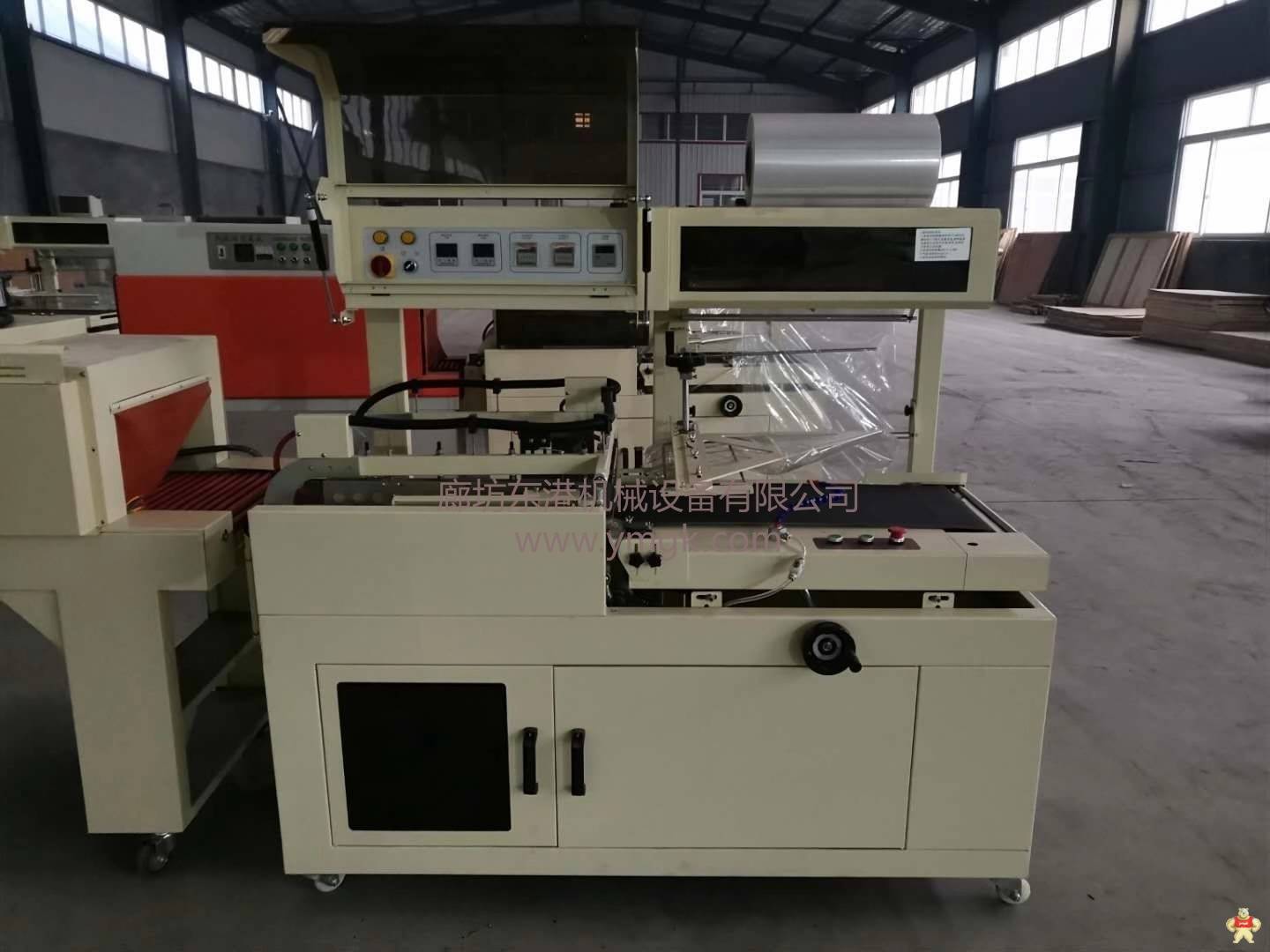 廊坊东港全自动热收缩膜包装机通过ISO9001认证 热收缩膜包装机,边封包装机,L型封切包装机,全自动包装机,袖口包装机