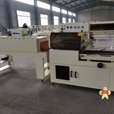 廊坊东港全自动热收缩膜包装机通过ISO9001认证 热收缩膜包装机,边封包装机,L型封切包装机,全自动包装机,袖口包装机